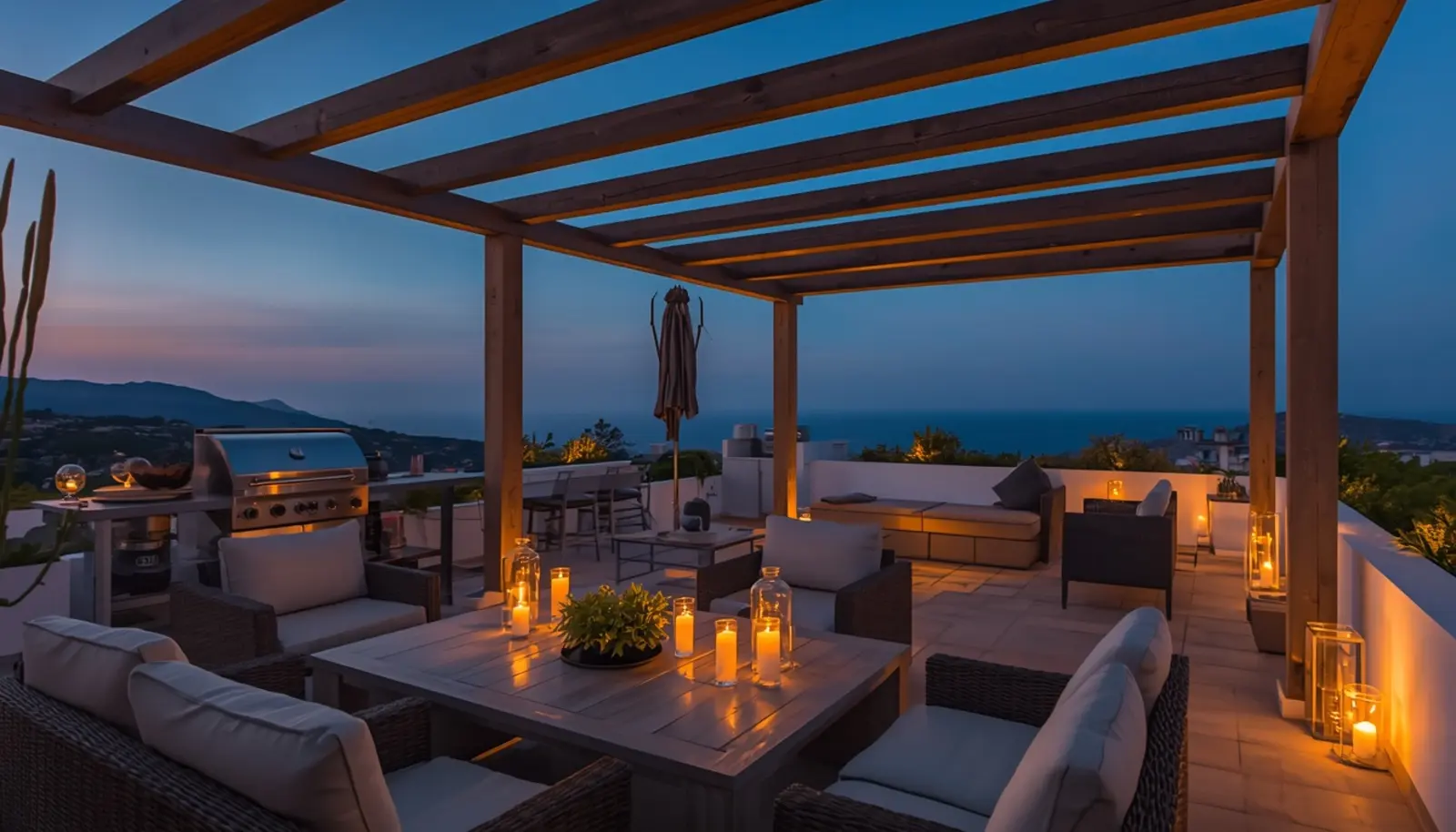 Terrazza esterna con pergola, barbecue e zona relax al tramonto