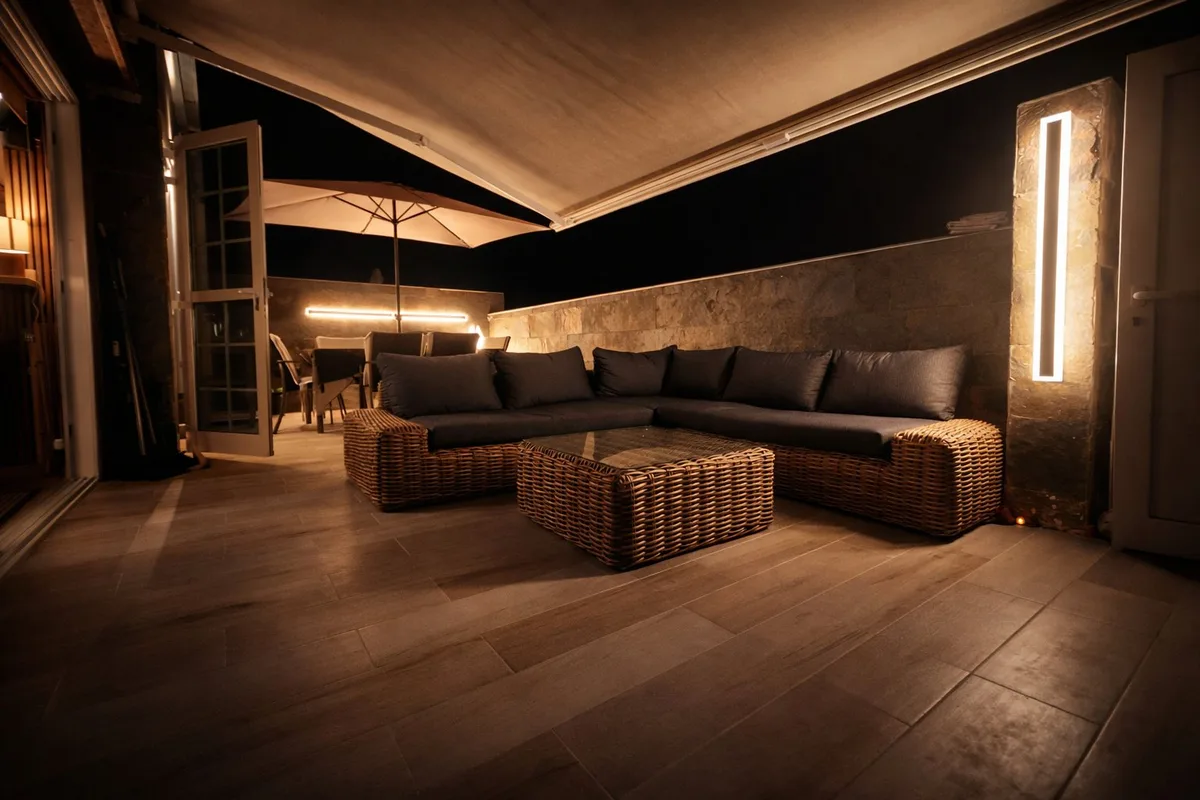 Outdoor terrace at night with custom lighting
